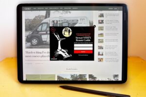 A tablet device shows Golf.com on a web browser. In the middle of the site is a pop-up displaying a giveaway.