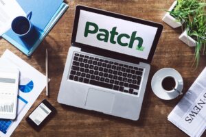 Patch logo on top of a laptop.